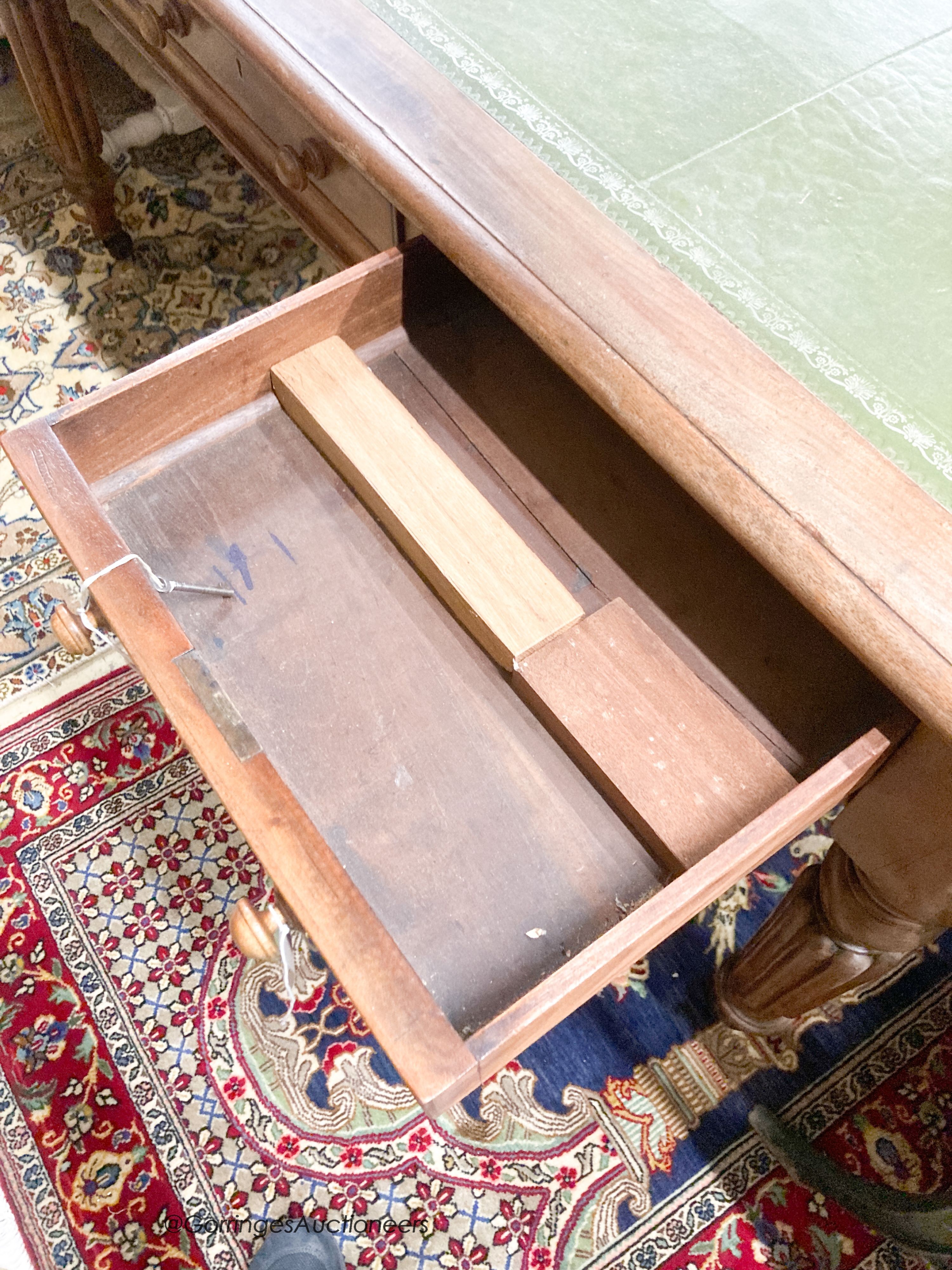 A Victorian mahogany three drawer writing table, width 150cm, depth 82cm, height 75cm